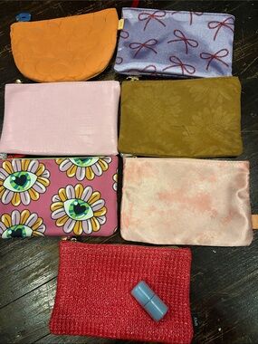 7 Ipsy Cosmetic Pouch/Makeup Bags. Plus REALHER travel size lipstick in Brave